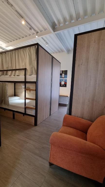 A 10-bed mixed dorm room with bunk beds